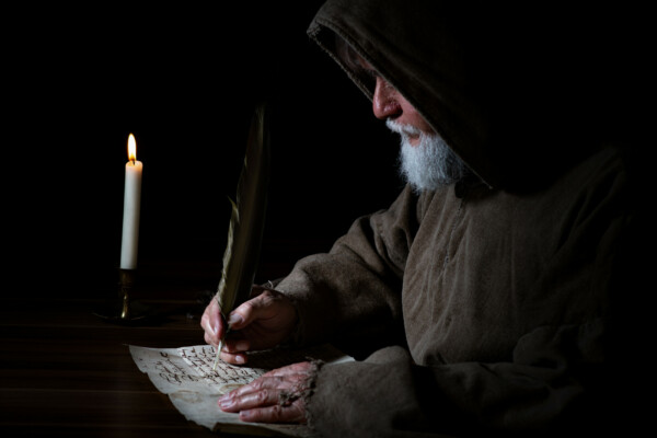Monk writing on parchment