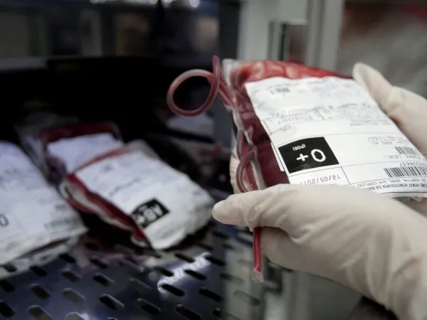 A doctor handles blood transfusion packs